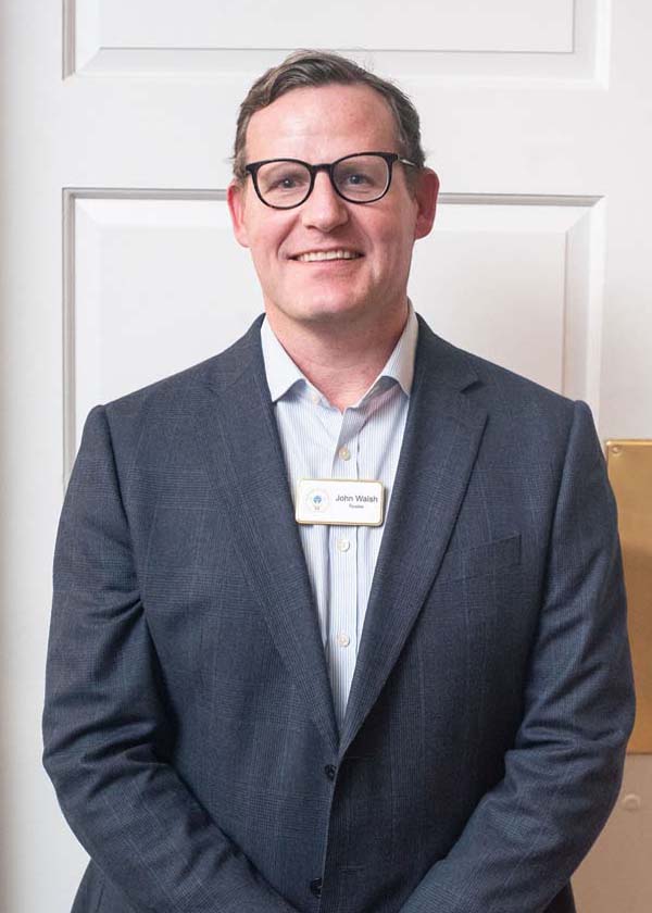 male wearing white shirt and blue jacket