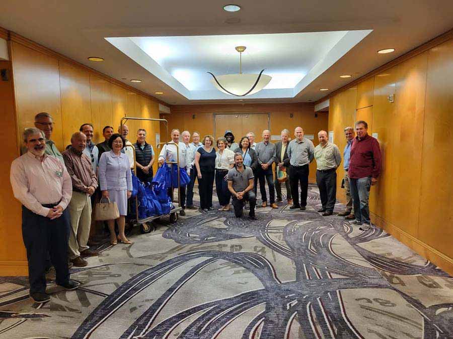 group of people standing inside a hallway